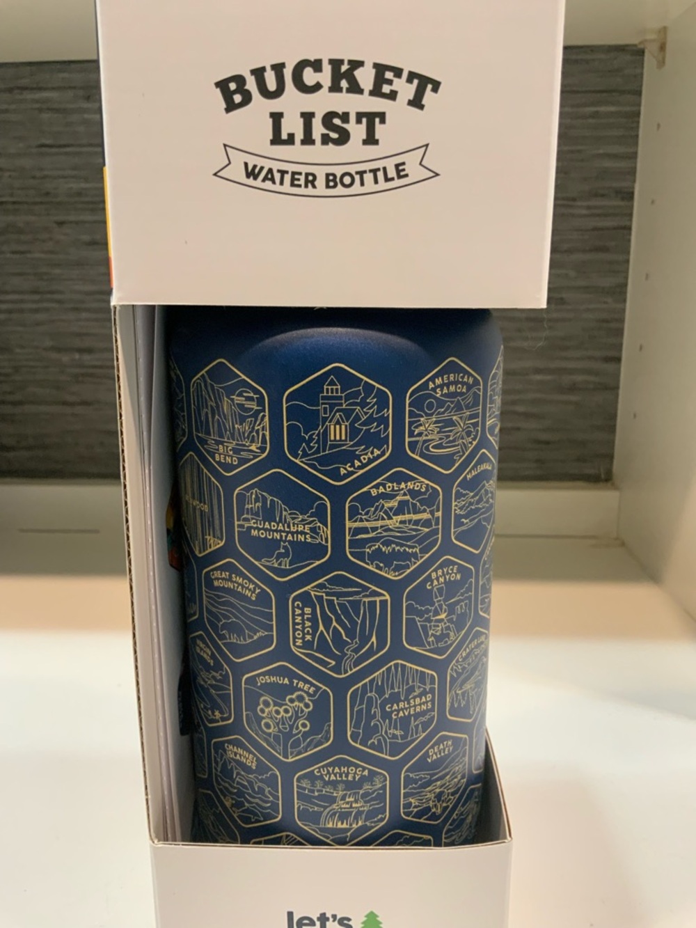 BUCKETLIST Navy Blue Water Bottle with Gold Travel Icons